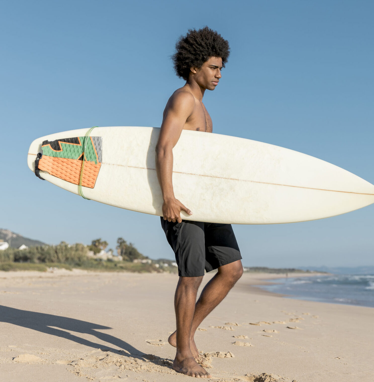 adult-african-american-man-preparing-surfing