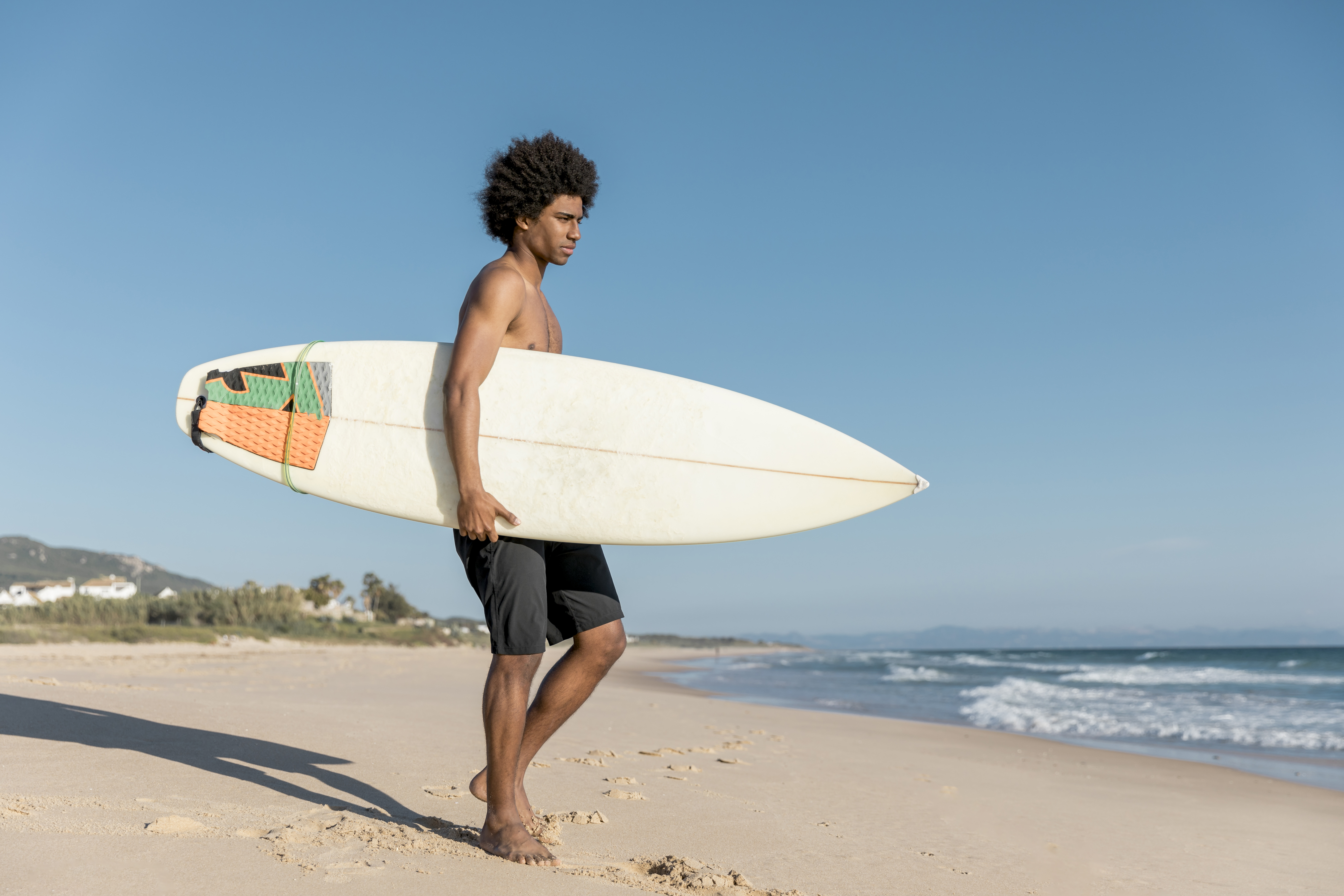 adult-african-american-man-preparing-surfing